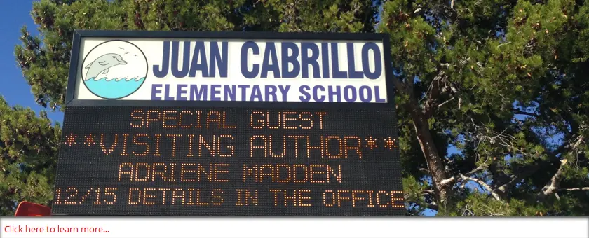 Visiting author announcement on school sign